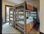 Four twin beds, with rustic finishes